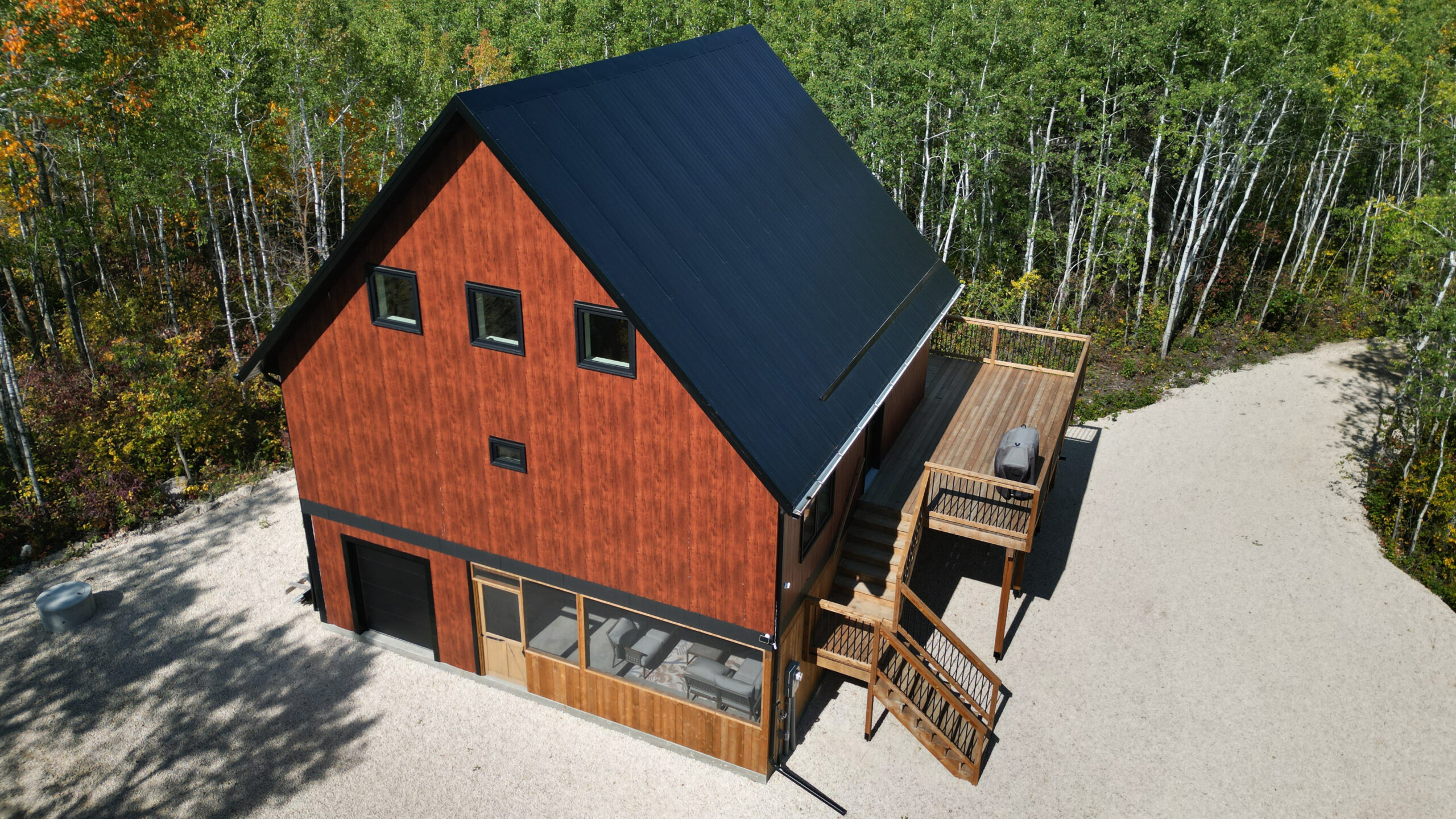 closer view of cabin exterior with black steel roof